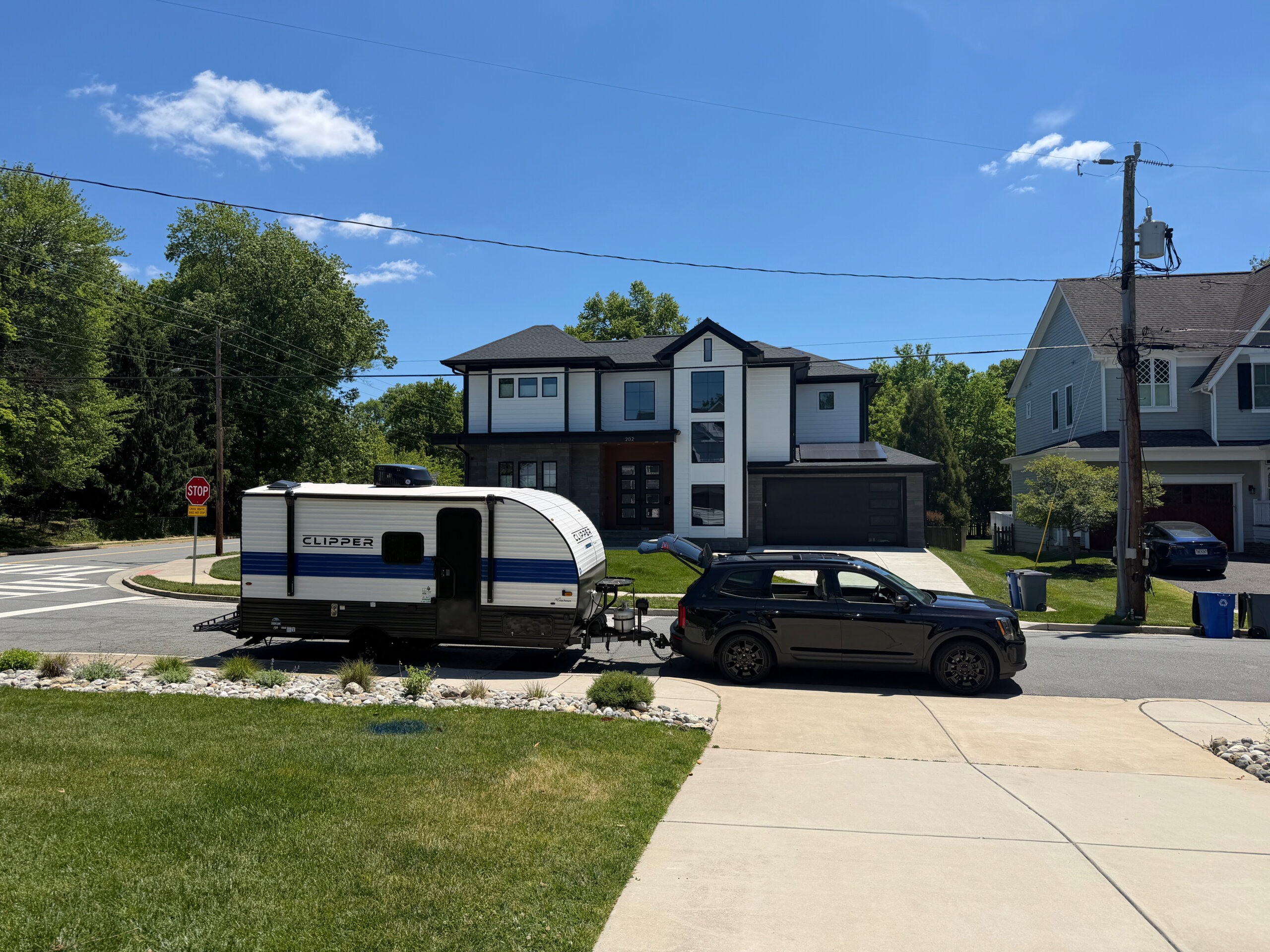 Coachmen Clipper hitched to my SUV in the driveway, ready to roll