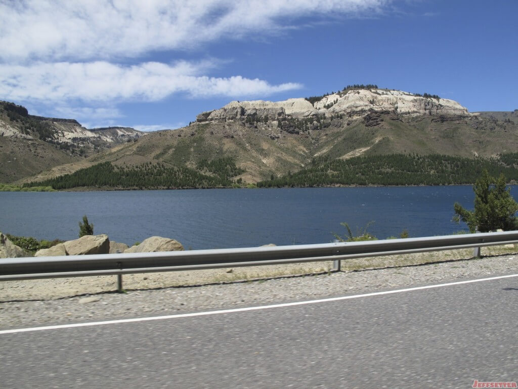 Beautiful White Capped Mountain with a Roadside lake