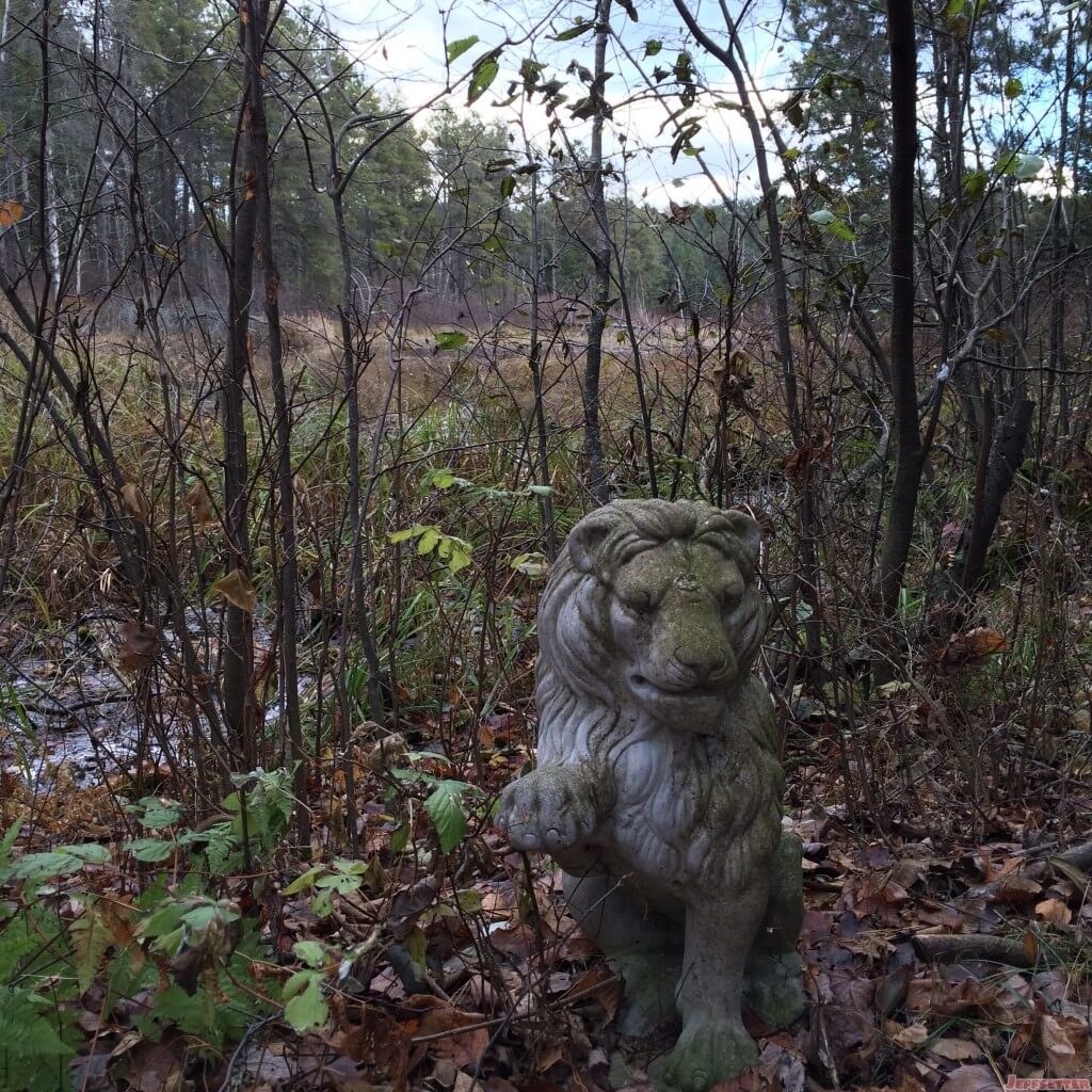 Random Lion Statue in the Woods