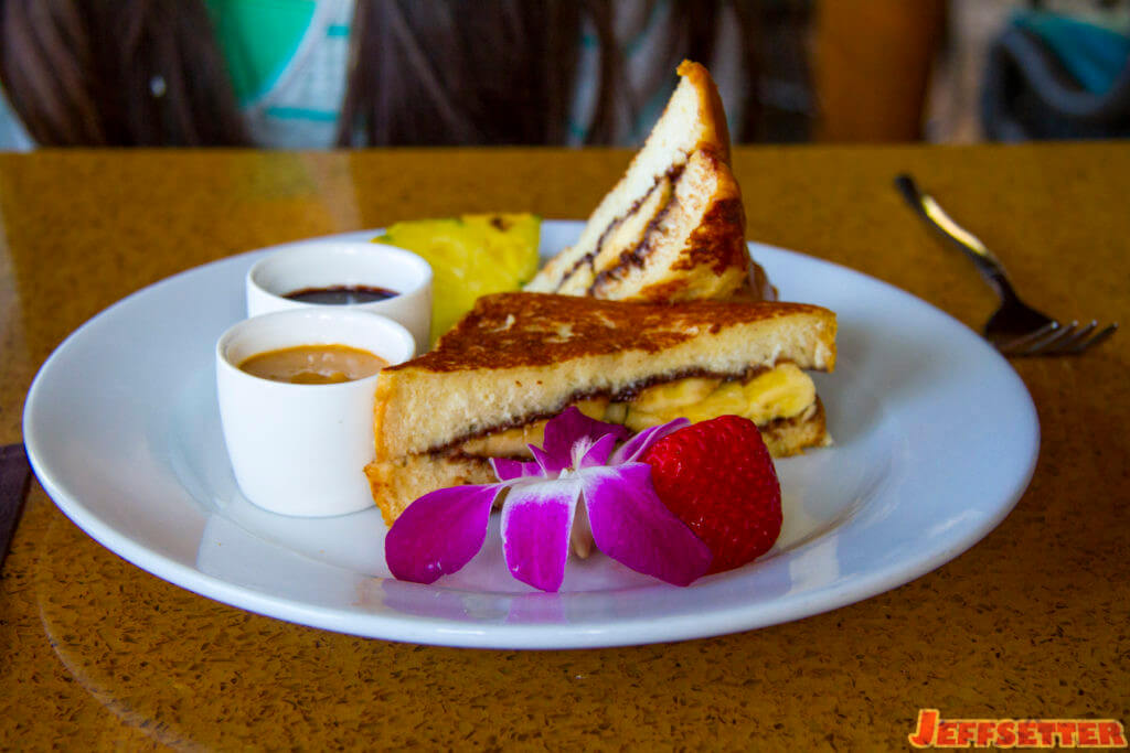 Chocolate milk dipped haupia french toast stuffed with chocolate, bananas, and peanut butter - breakfast