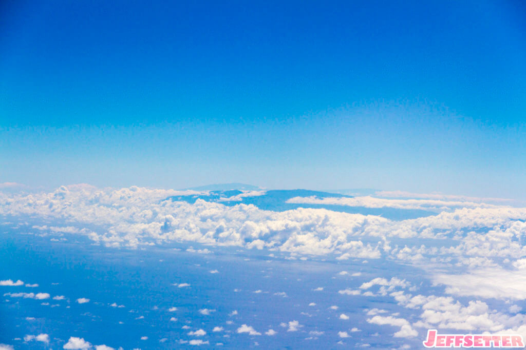 Haleakala, Mauna Loa, and Mauna Kea off in the distance.