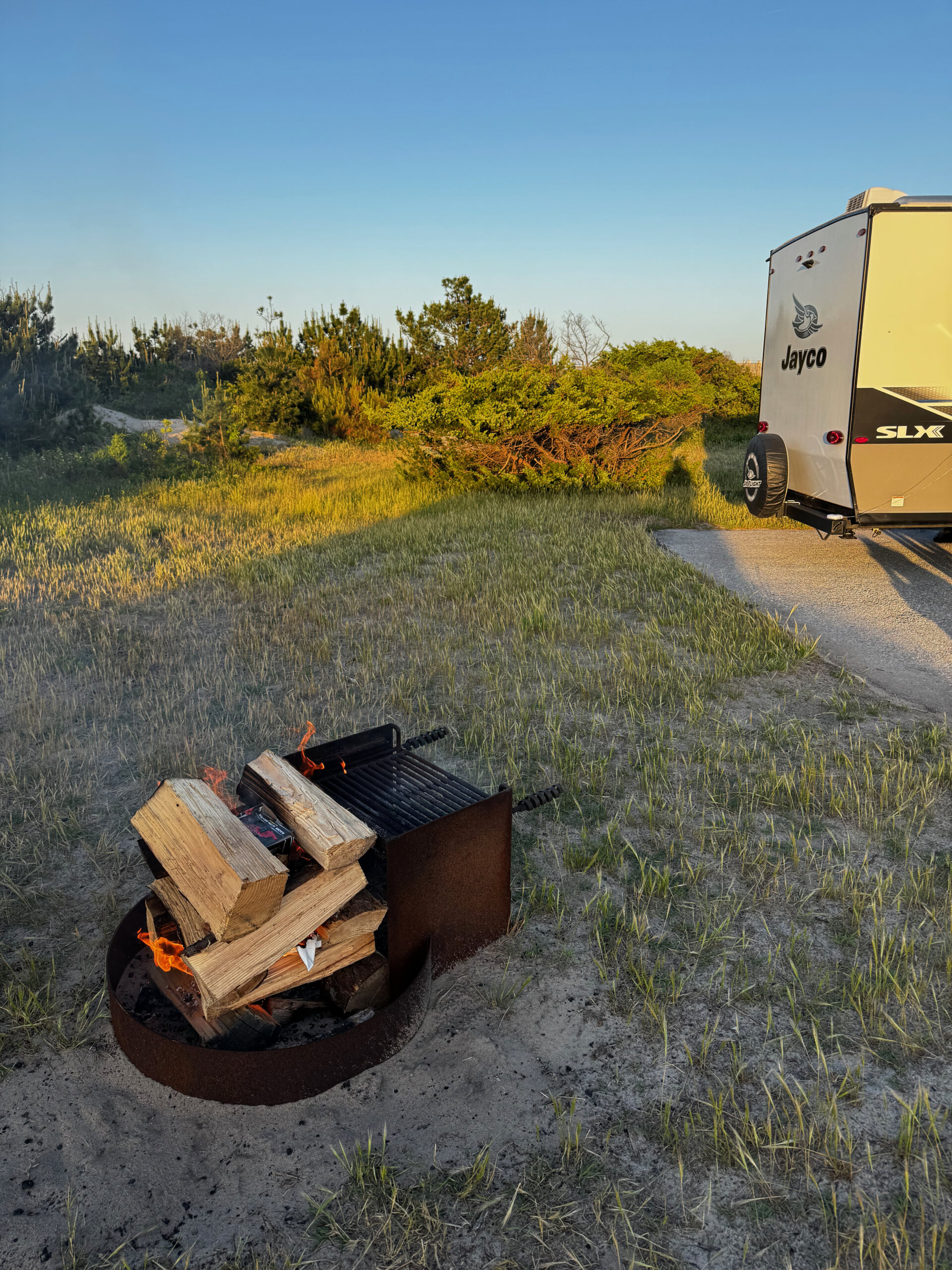 Last year's setup at the same campground. Different rental (a Jayco SLX), same magic in the late-afternoon light.