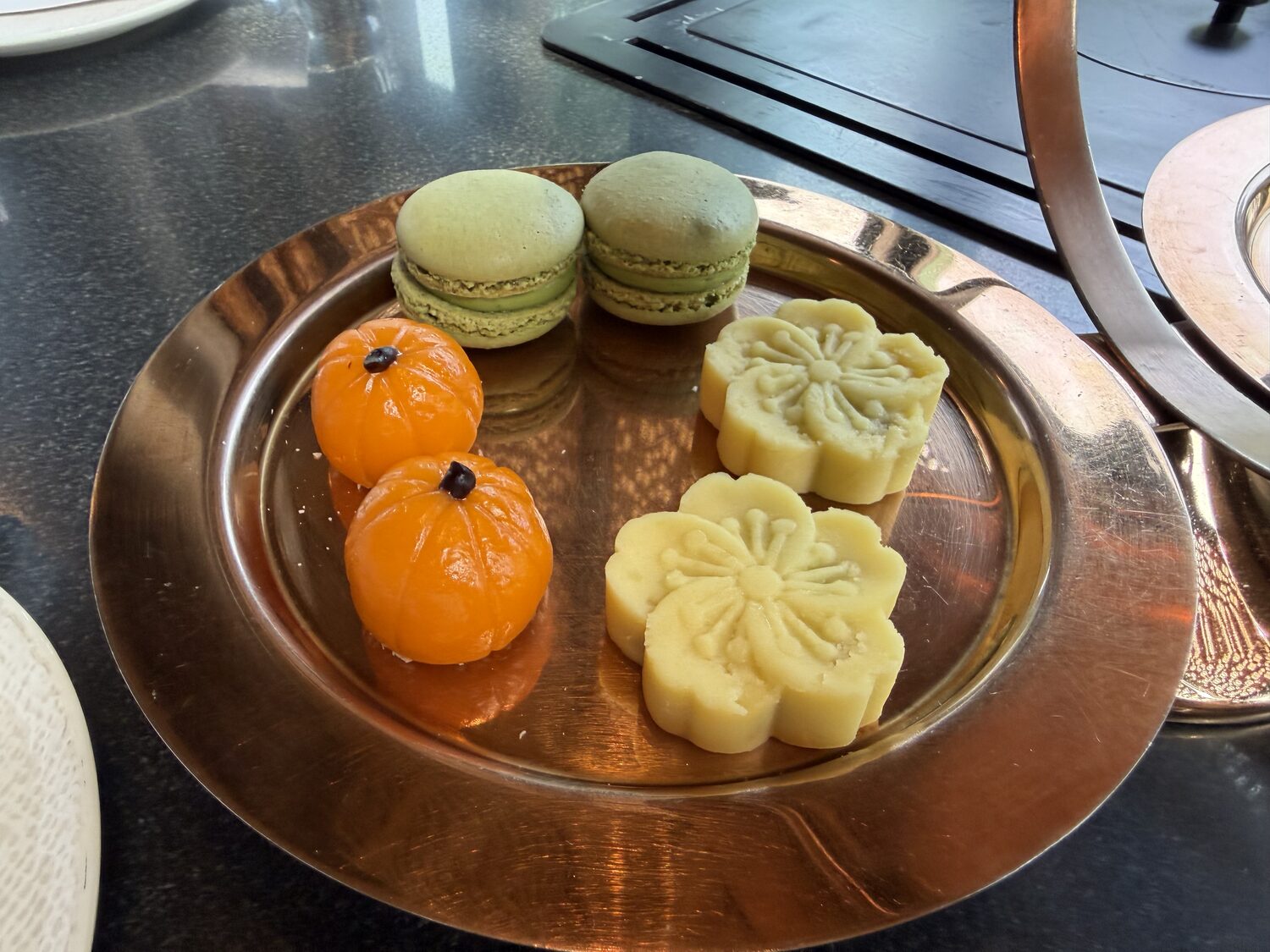 Macarons and the flower-shaped pastries.