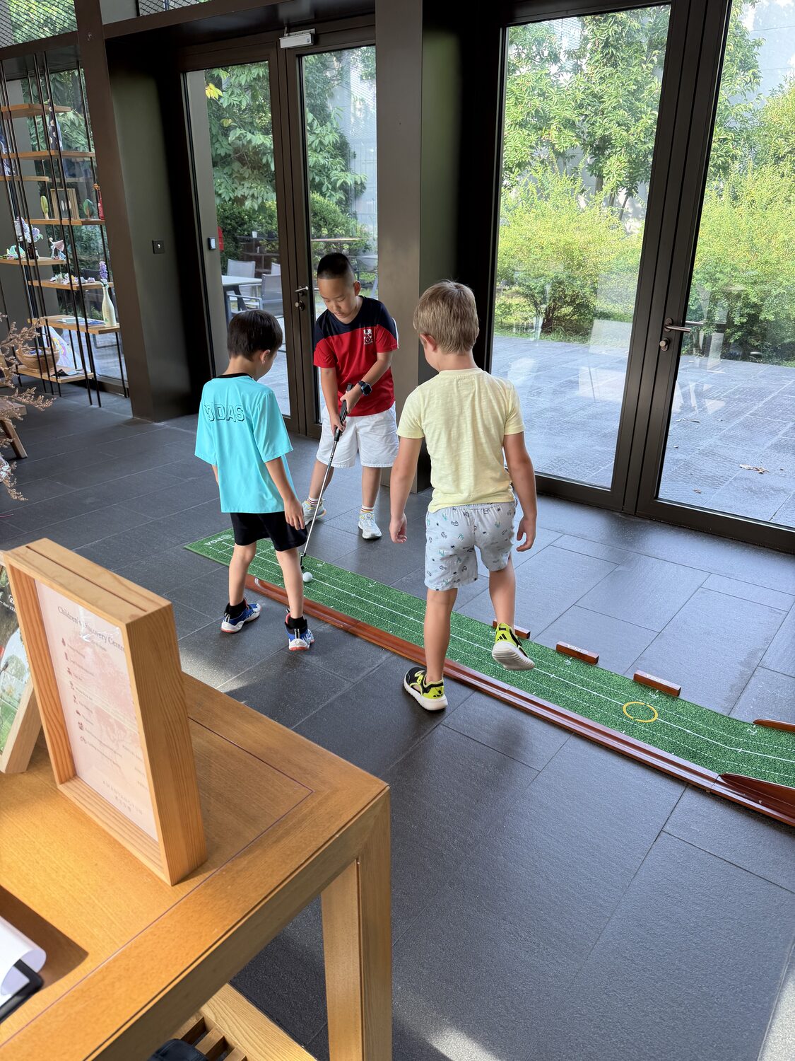 There's an indoor putting green. He found it immediately.