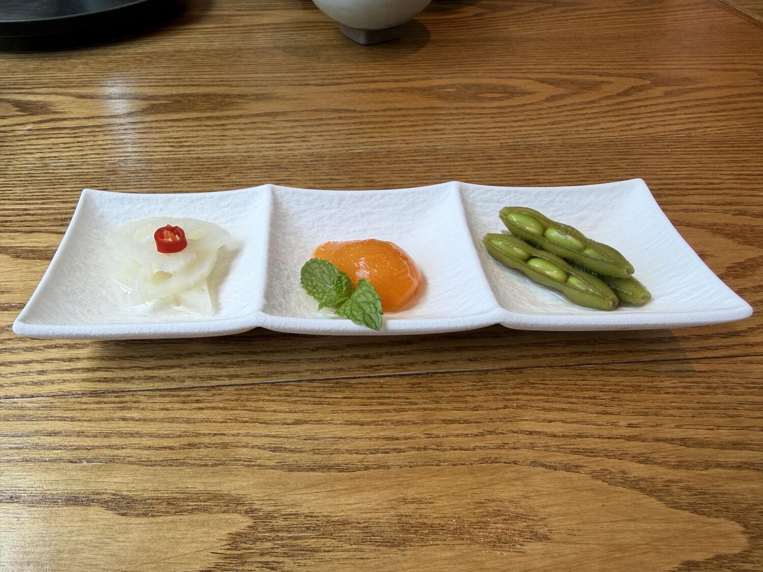Pickles and edamame to start.
