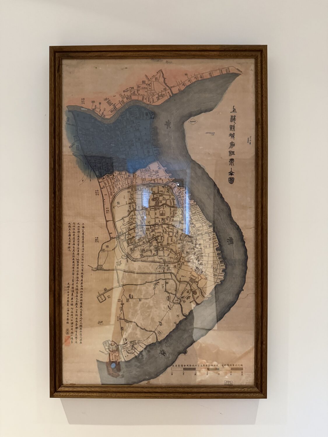An antique map of Shanghai, framed.
