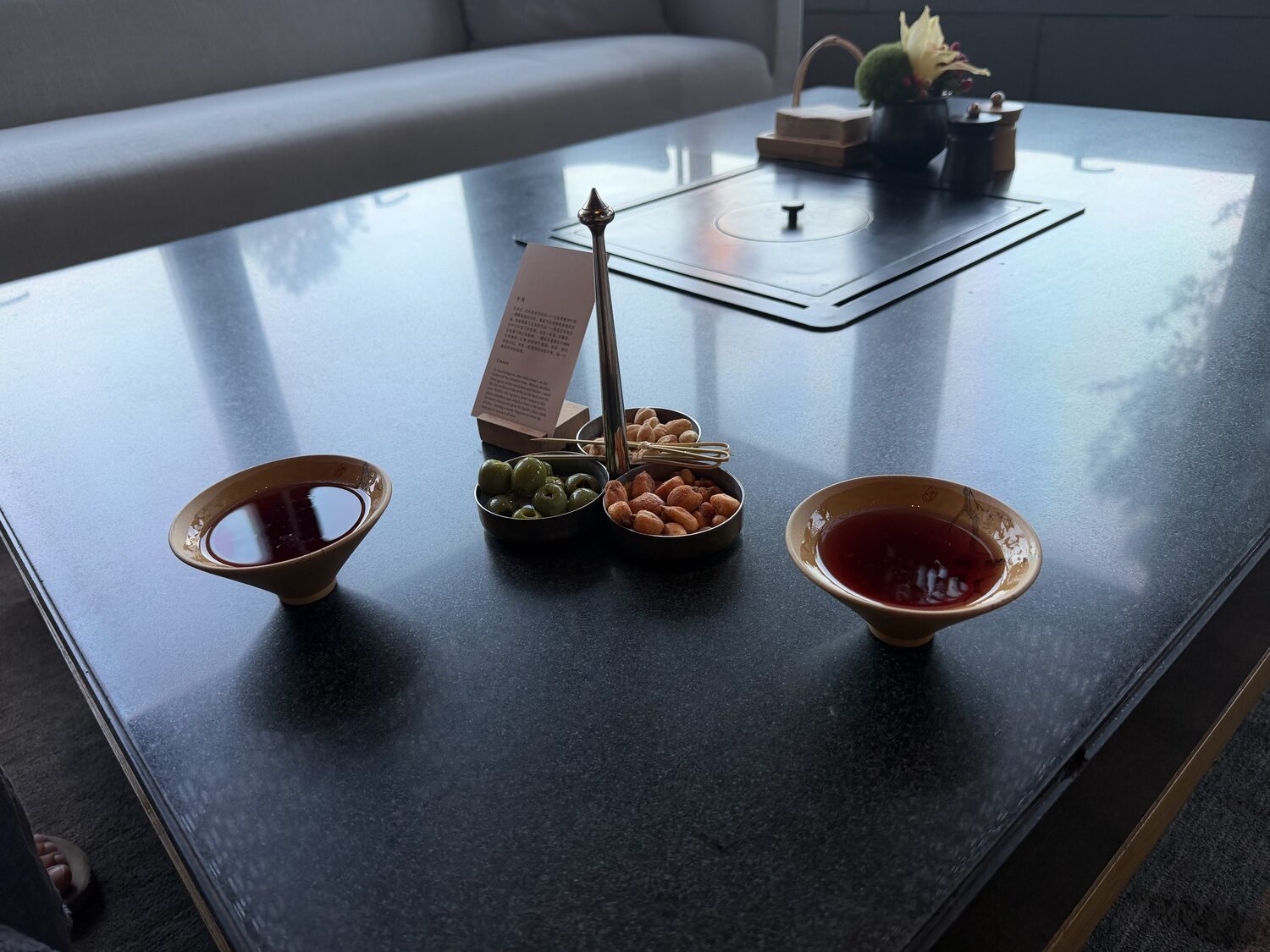 Snacks and incense on the low table.